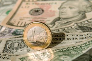 1 eur coin and 1 usd bills