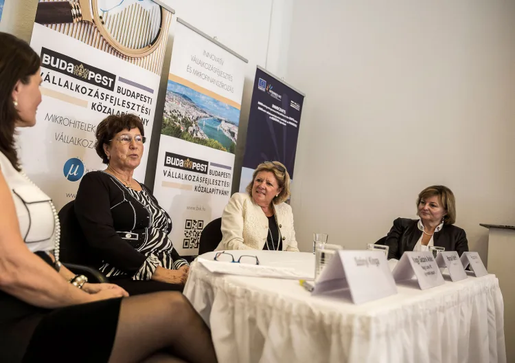 4 women having a talk at a conference