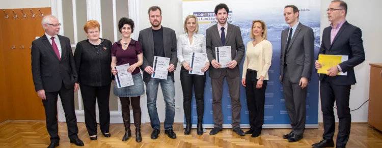 group photo of people holding their certificates